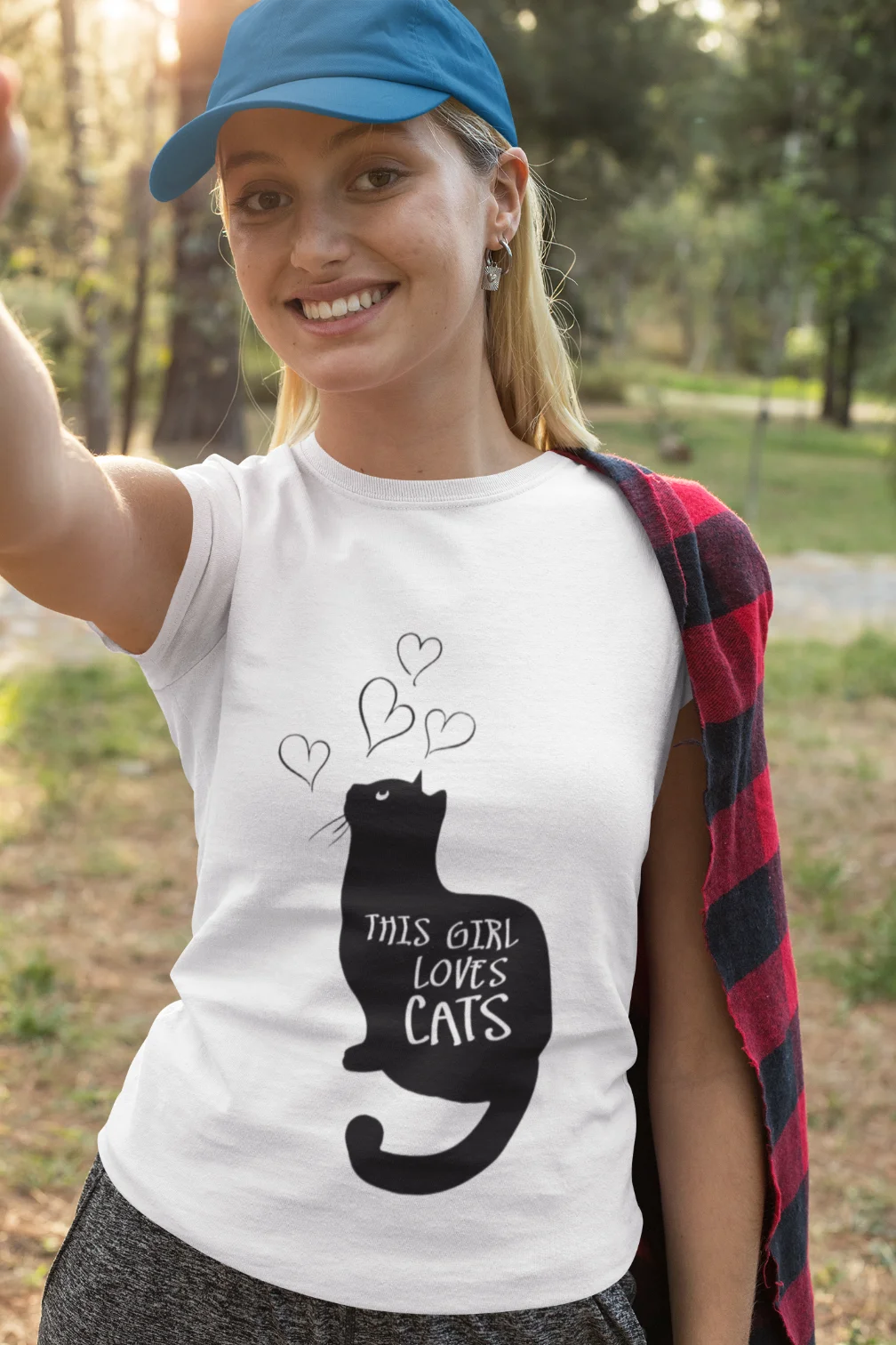 model wearing white t-shirt with black cat fun design